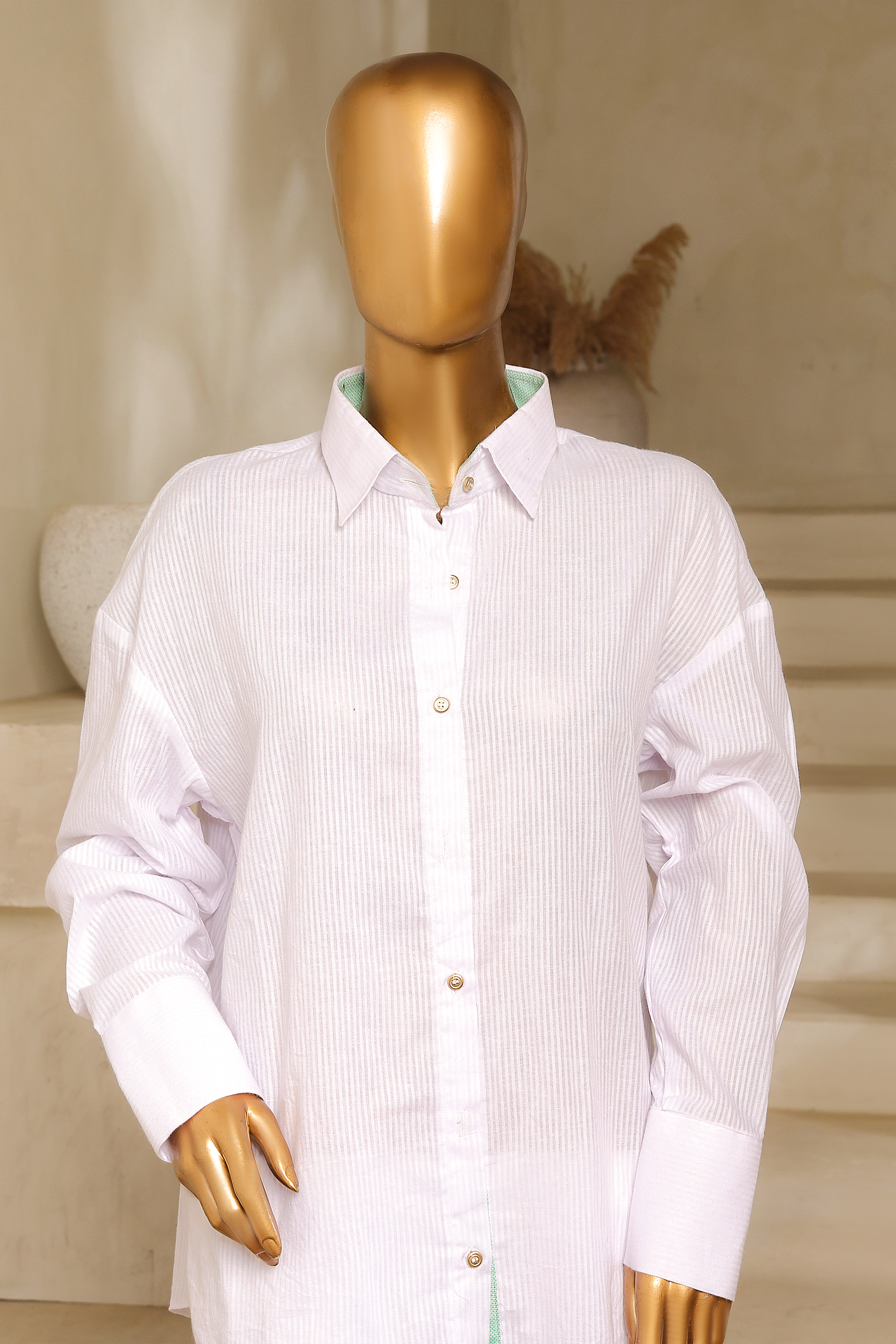 White self-lawn button-down shirt with golden buttons, gents collar, and cuffed sleeves from Zananii’s Zoya Collection.