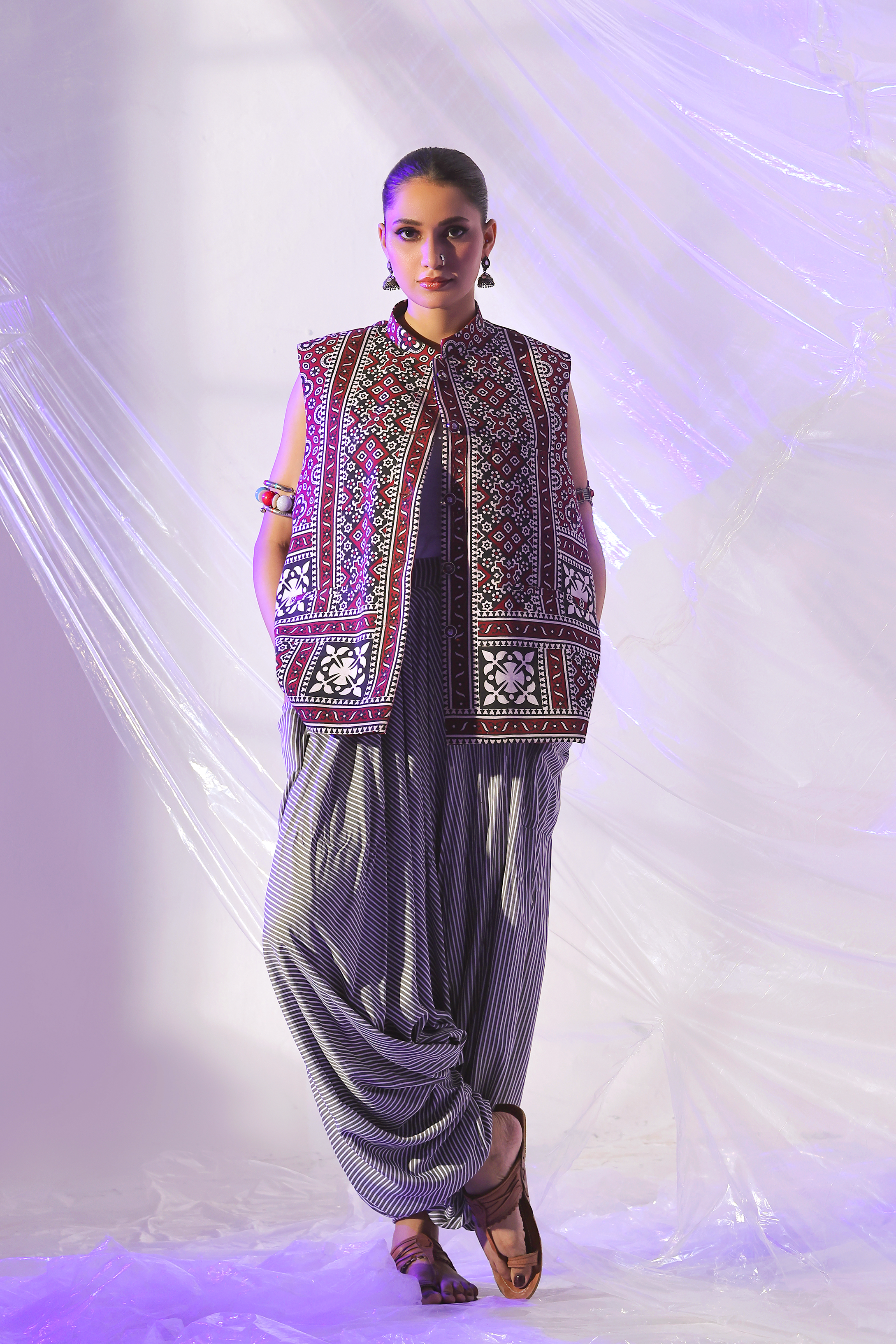 First Dam Hama Dam Ajrak Waistcoat and Striped Boho Shalwar by Zananii handcrafted cotton women’s ethnic wear in maroon and black featuring a mandarin collar and traditional Ajrak pattern