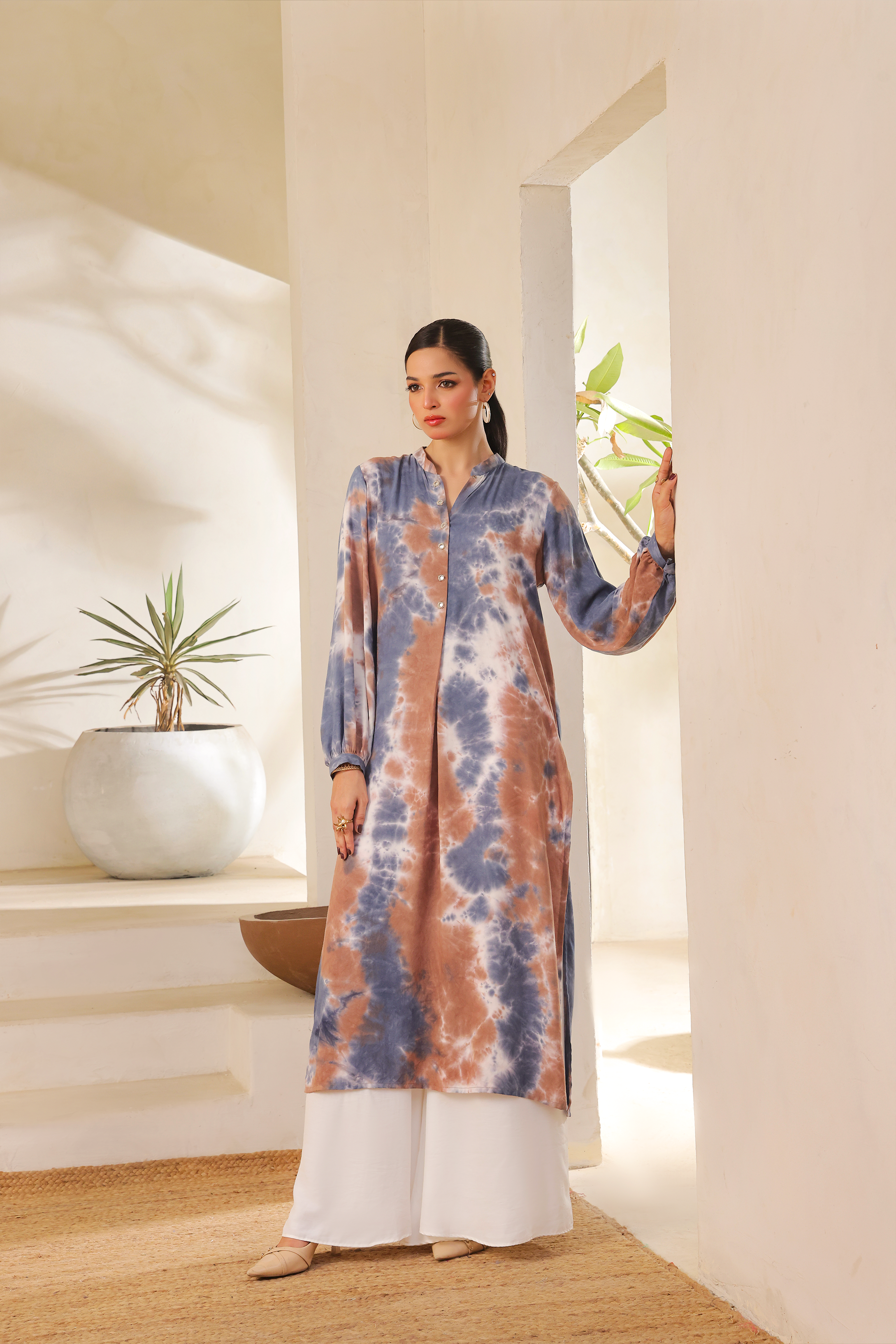 First Blue and brown tie-dye kurta set by Zananii, featuring mirror button details and white izaar pants for a stylish and comfortable everyday look.