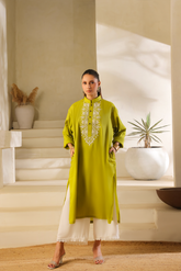 First Olive green cotton mul kurta by Zananii with white embroidery and button detailing, paired with white viscose pants for a light and timeless everyday look.