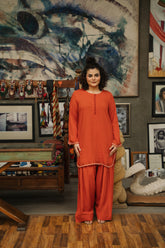 Rust crab linen jogi-style kurta and wide-leg shalwar set by Zananii from the Jogan Collection, crafted from soft, breathable fabric for a relaxed everyday look.