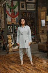 Powder blue cotton linen embroidered shirt with tulip shalwar by Zananii from the Maahe Collection, featuring delicate embroidery booti detailing.