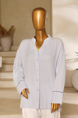 Second Light blue linen button-down shirt with silver buttons and mandarin collar from Zananii’s Zoya Collection.
