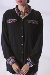 Third Black slub viscose button-down shirt with Ajrak pocket detailing, paired with loose ijaar trousers from Zananii’s Zoya Collection.