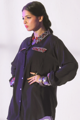 Black slub viscose button-down shirt with Ajrak pocket detailing, paired with loose ijaar trousers from Zananii’s Zoya Collection.