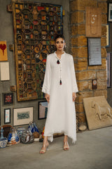 White viscose linen kaftan shirt by Zananii from the Saakht Collection, featuring tassel detailing on the collar and soft ruffle accents.